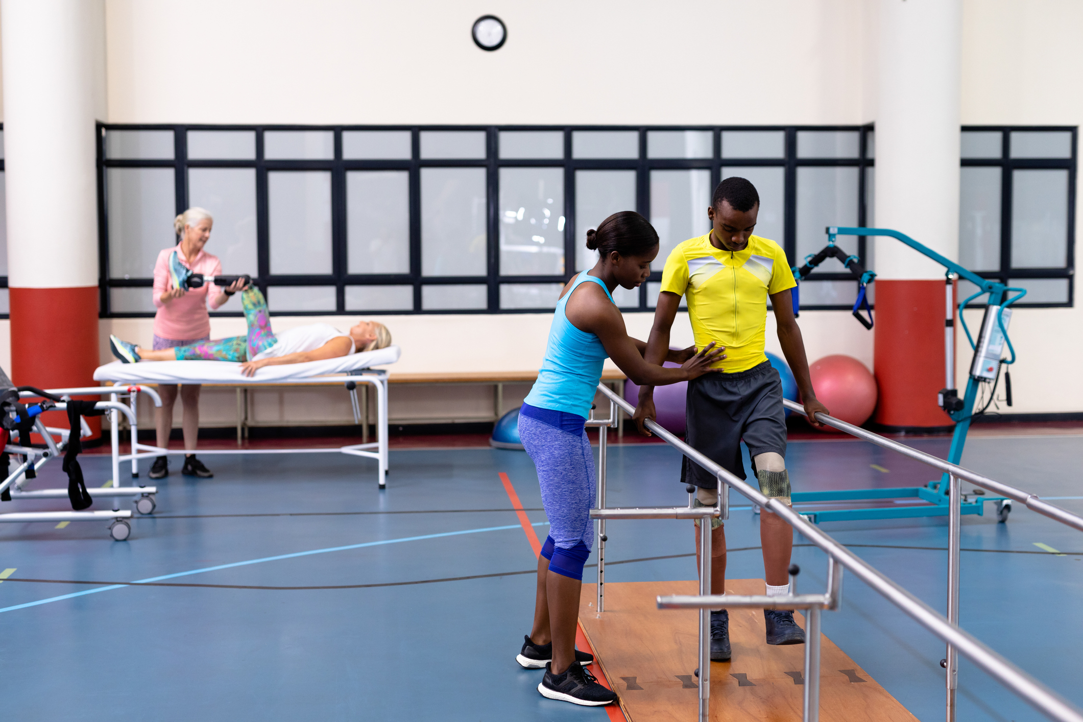 Patients getting physical therapy treatment at clinic Photo of patients getting physical therapy treatment at clinic
