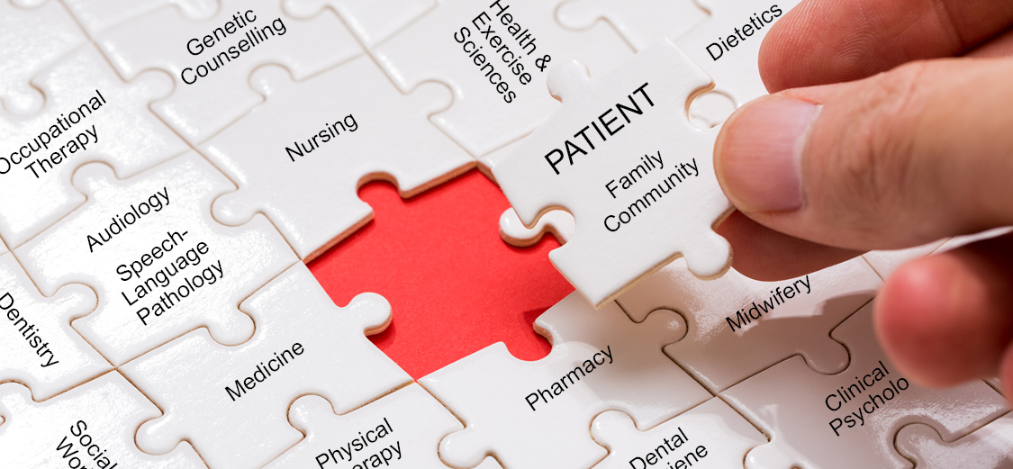 Puzzle pieces labelled with names of UBC health programs with patients labelled on the centre piece