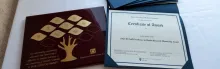 Photo of plaque and certificate