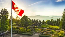 Photo of Canadian flag overlooking UBC campus