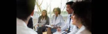 Photo of health professionals in team-based care meeting