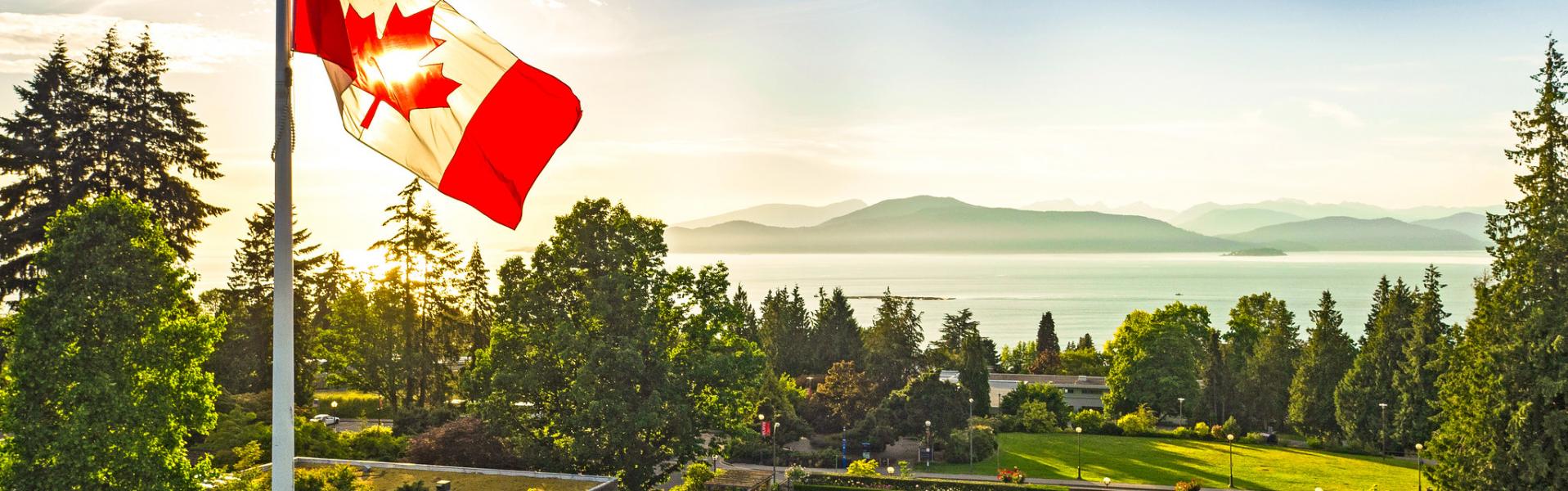 Photo of Canadian flag overlooking UBC campus